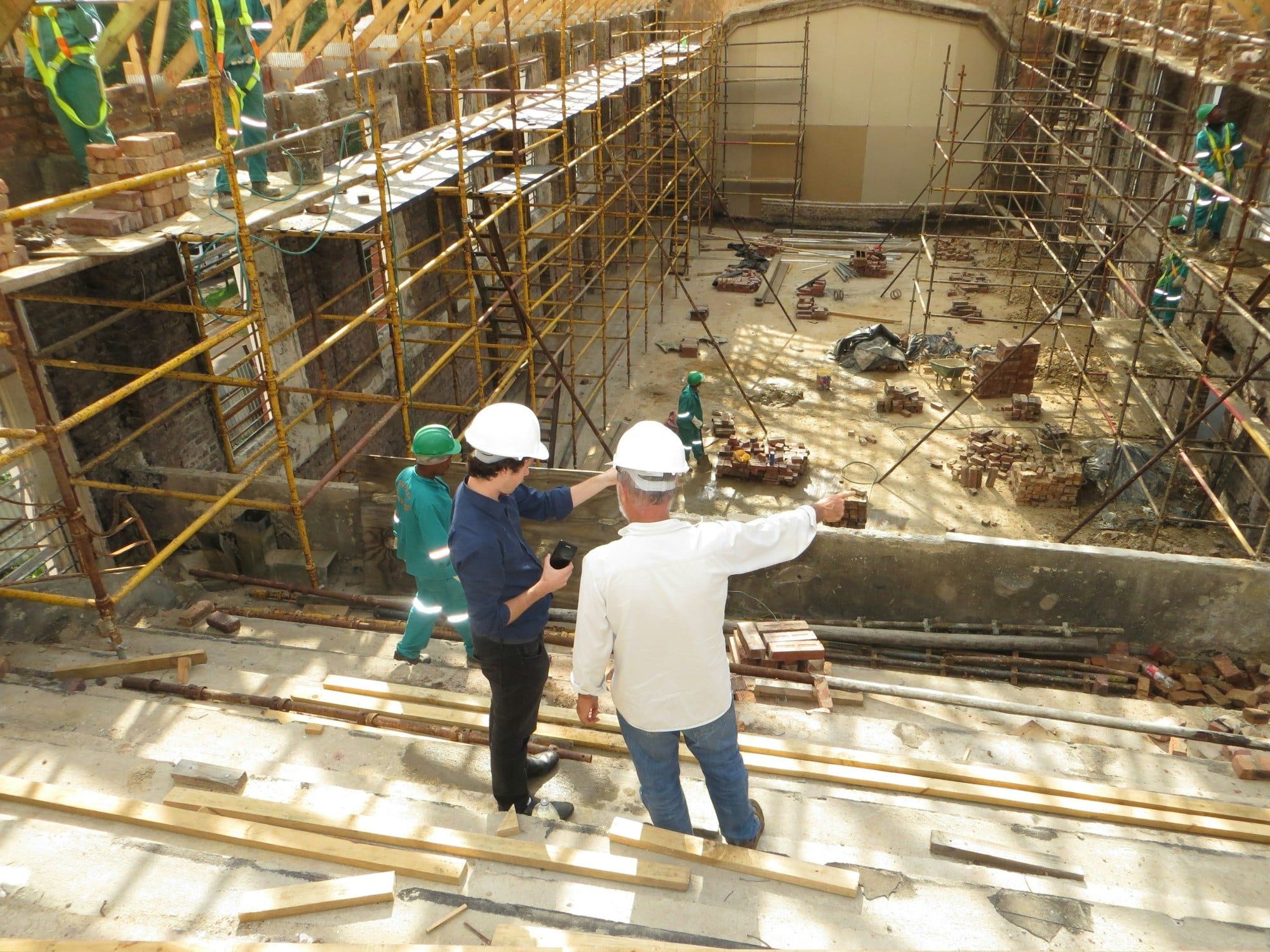 Site team reviewing progress on a building under construction